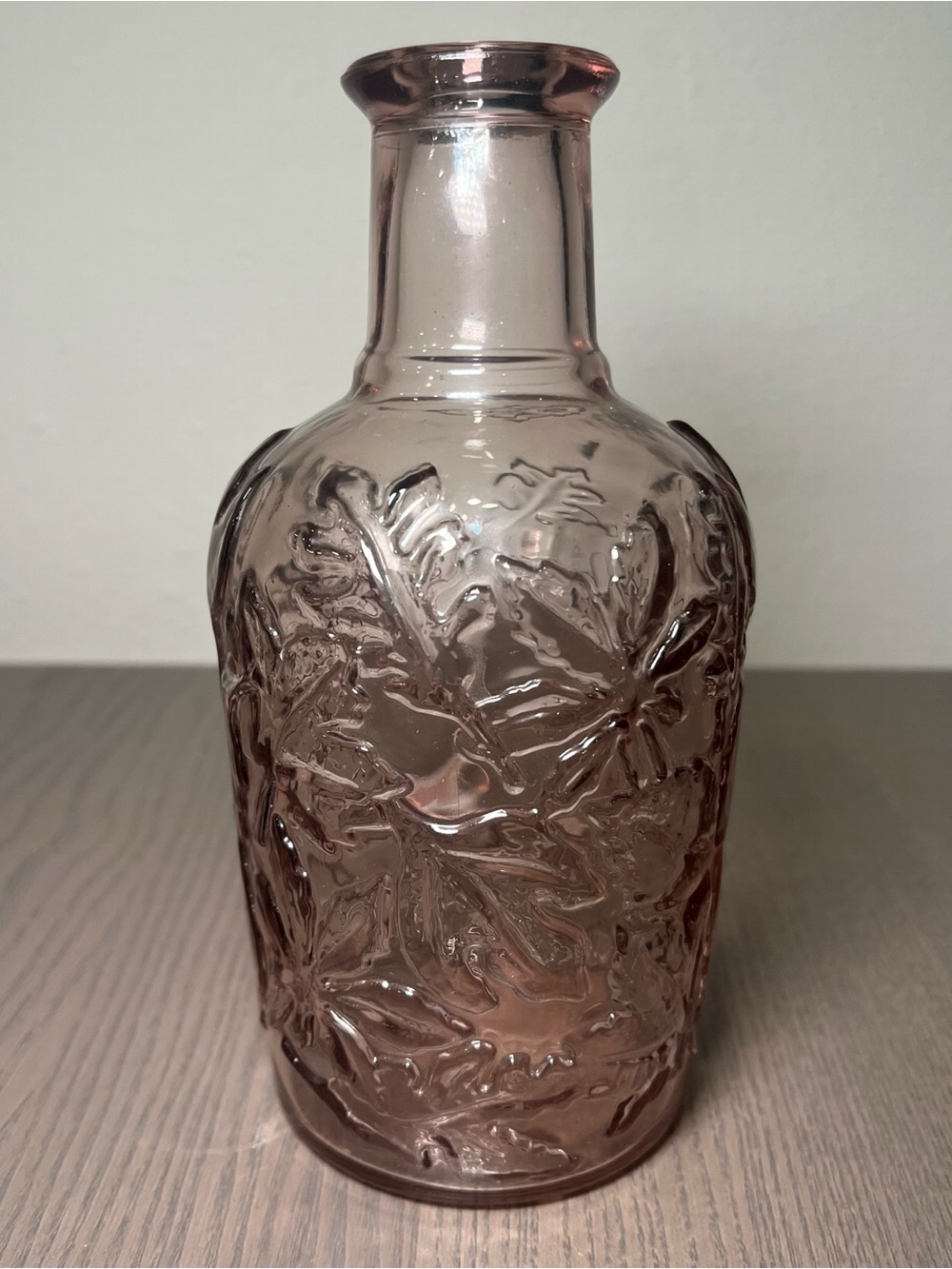 VINTAGE CANADA EMBOSSES WITH FLOWERS PURPLE GLASS BOTTLE DECOR WITH NO CORK
